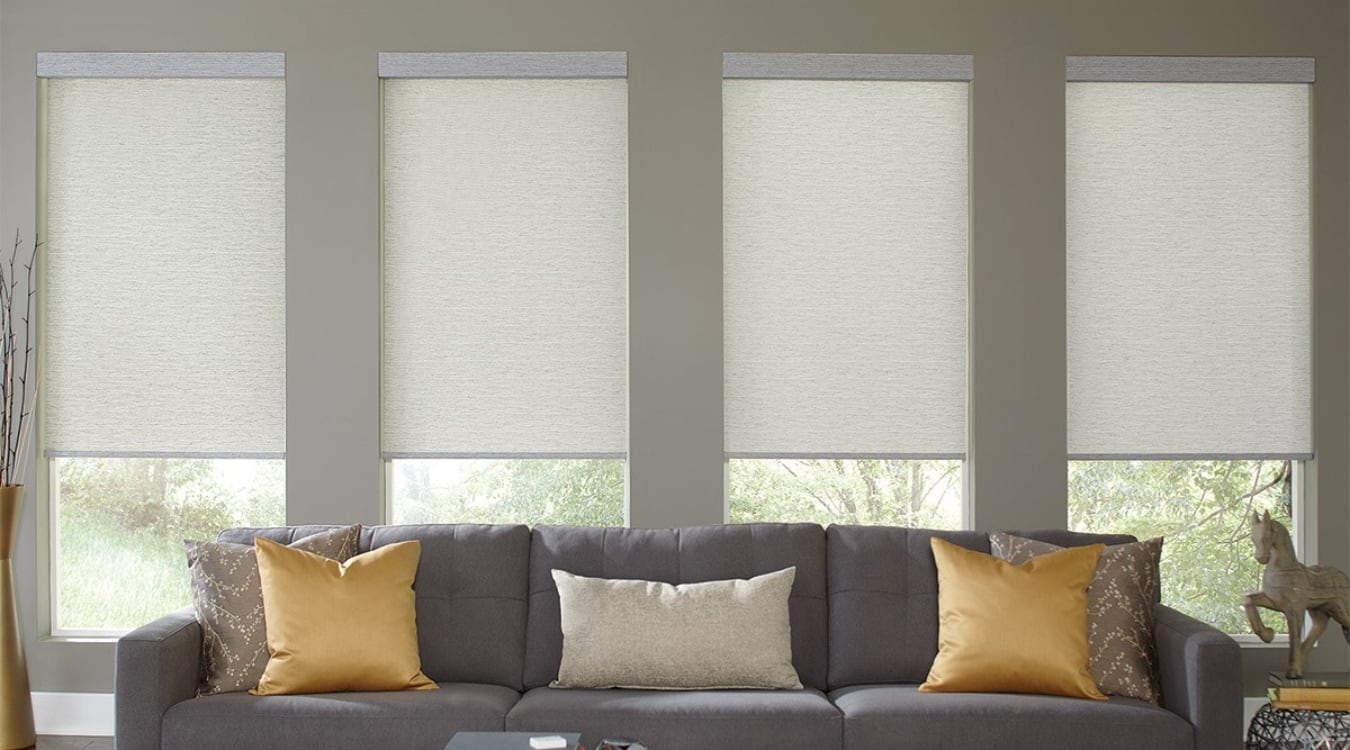 Motorized cordless window treatments above a couch